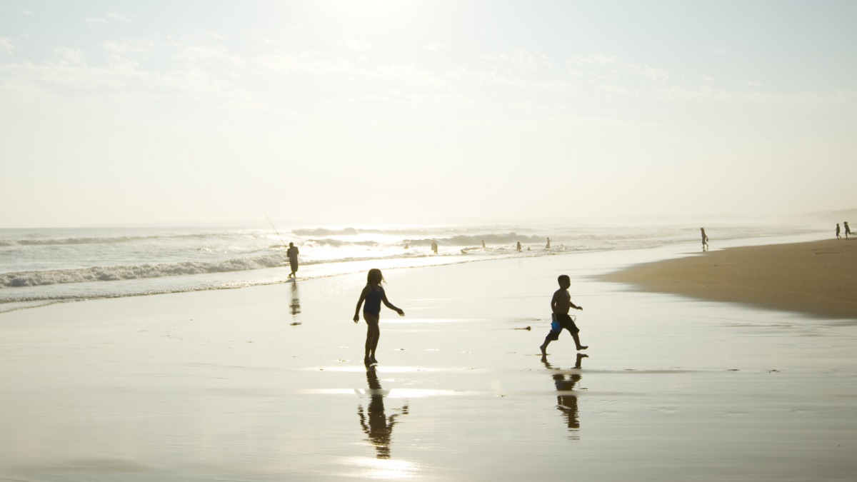children running on beach