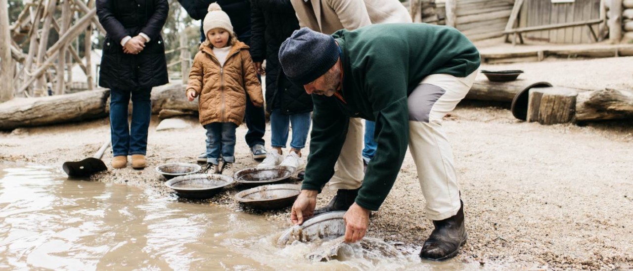 Sovereign Hill gold panning_Visit Victoria family panning for gold at Sovereign Hill